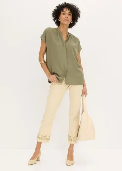 Blusa de manga corta con botones ocultos