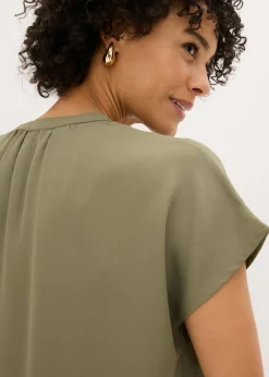 Blusa de manga corta con botones ocultos
