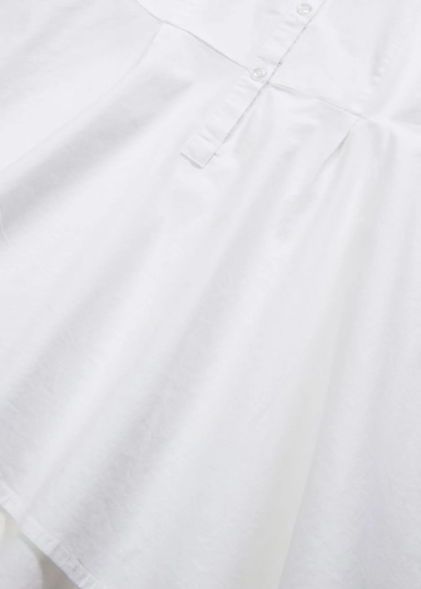 Blusa larga con volante