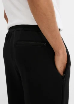 Pantalón de chándal térmico con prácticos bolsillos con cremallera